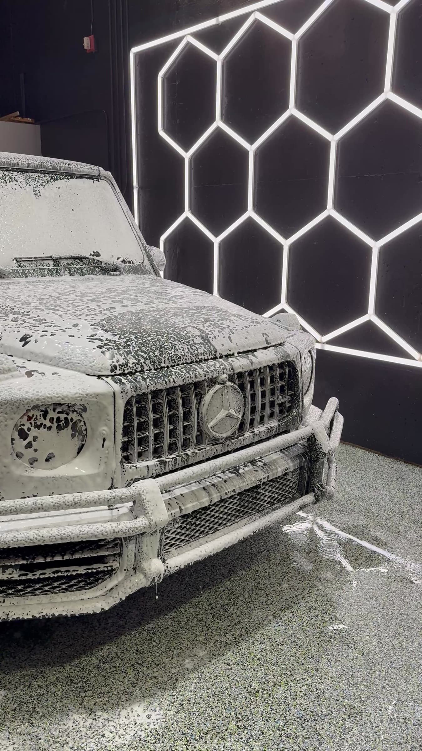 Mercedes-Benz G-Class covered in snow foam during an in-shop detail
