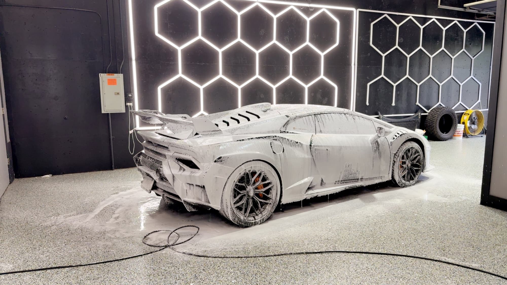 White Lamborghini Huracán STO under snow foam in the CHM studio